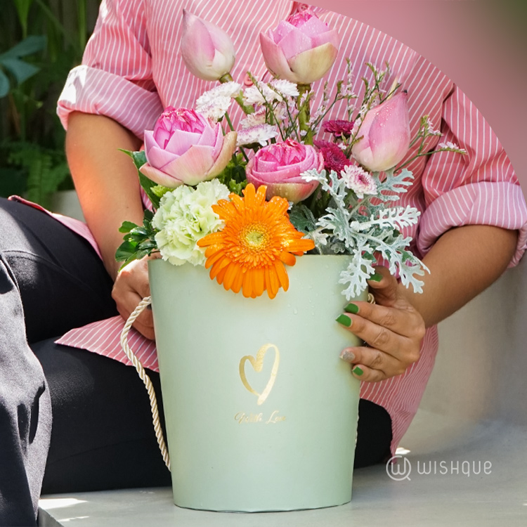 Gentle Radiance Floral Bucket