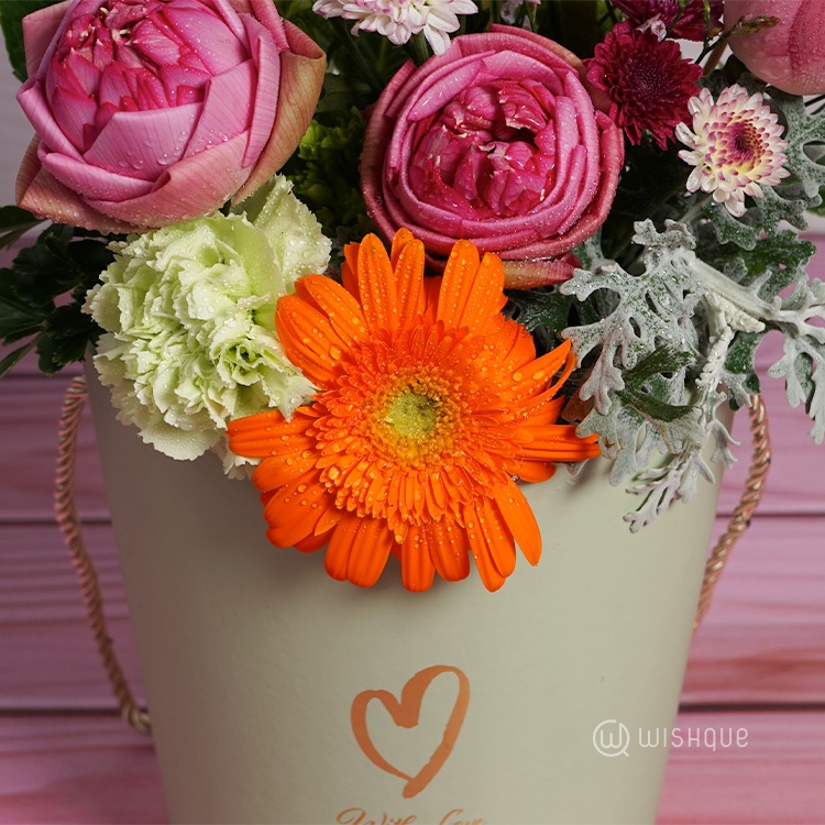 Gentle Radiance Floral Bucket